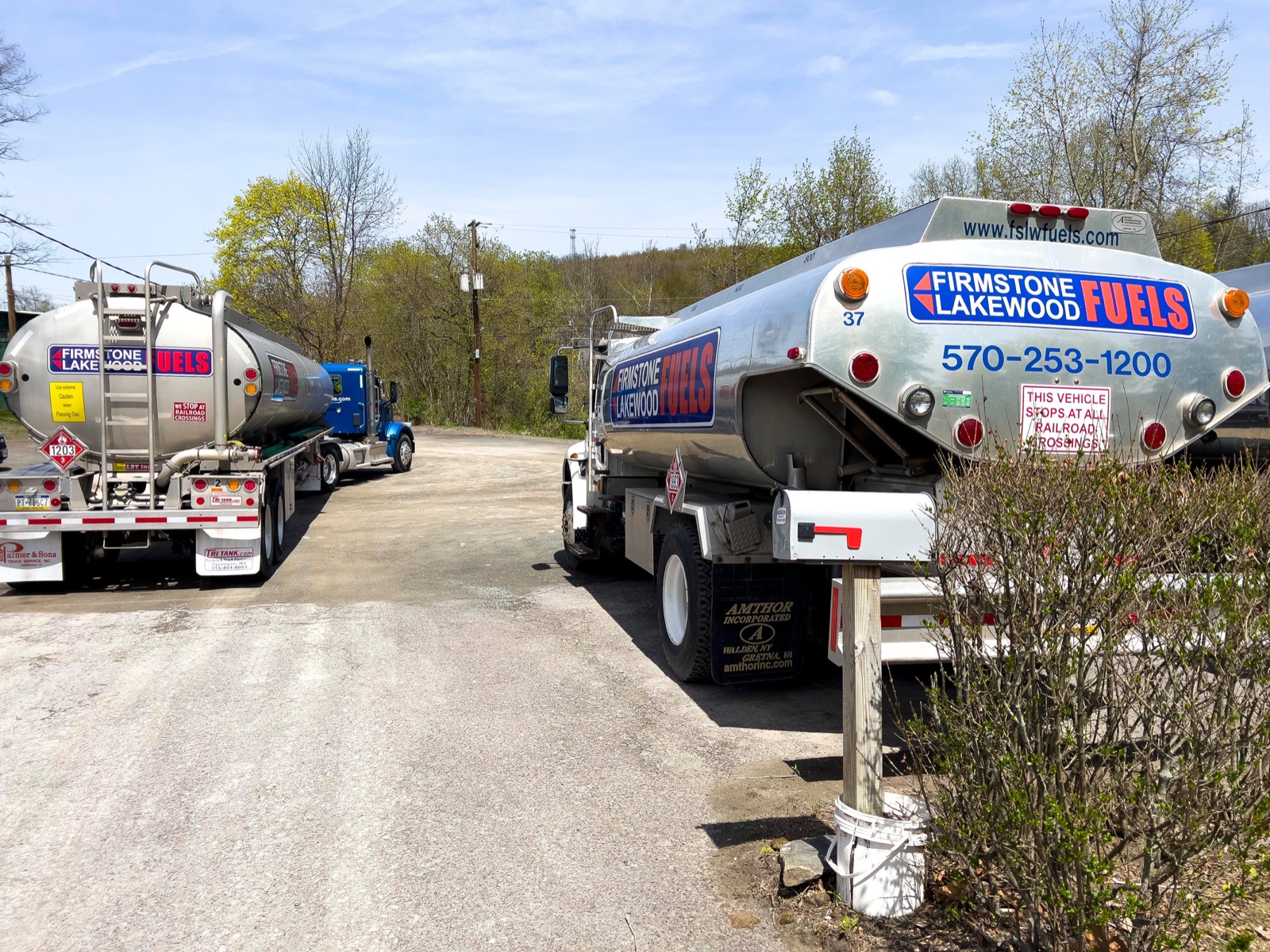 Two FL Fuels tankers loading at the depot with 570-253-1200 visible